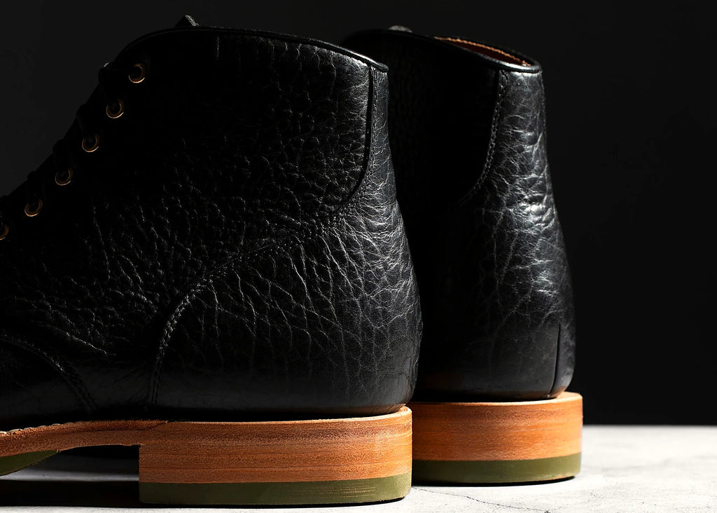 Goodyear welted perforated cap toe service boot in Black American Bison, full-grain leather heel counters