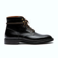 Black plain toe boot in Chromexcel, set on a micro stud rubber outsole