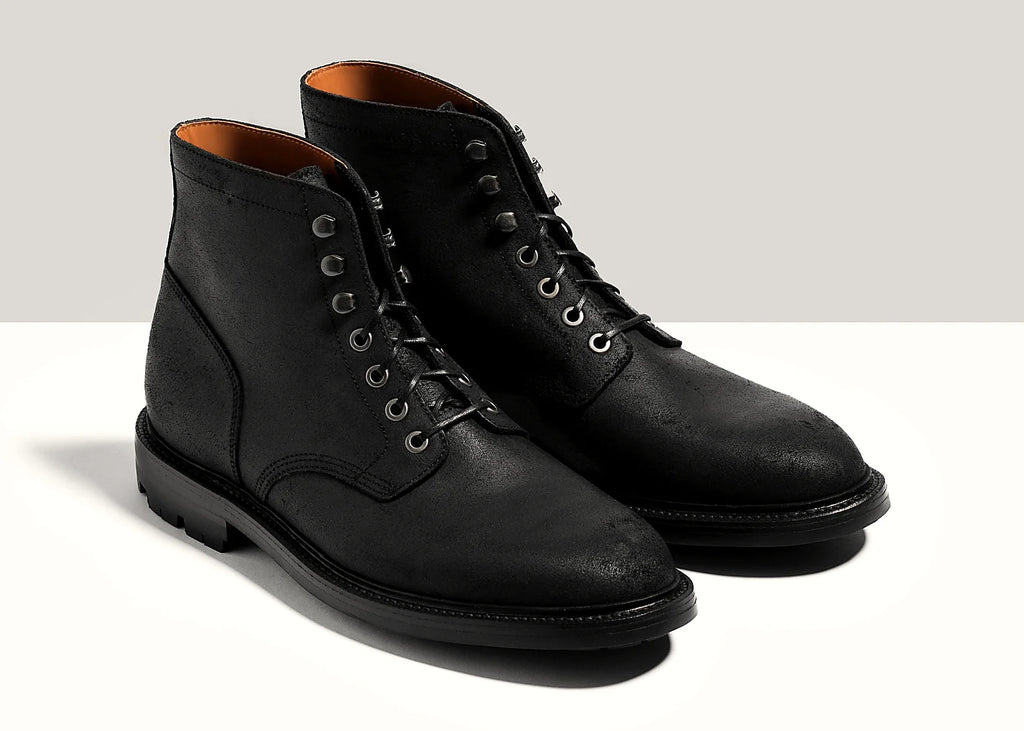 Black plain toe boot in Waxed Commander, set on a lug rubber outsole