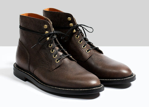 Black plain toe boot in Teton Waxy Stag deer, set on a micro stud rubber outsole