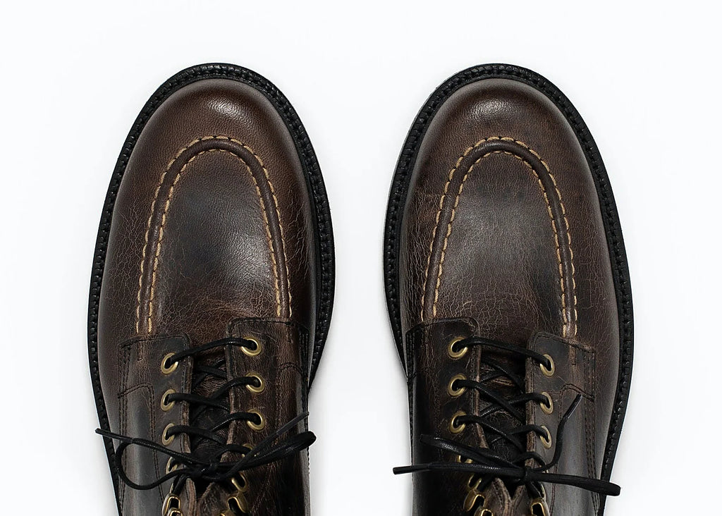 Black hand-sewn moc toe boot in Teton Waxy Stag deer, set on a Goodyear welt