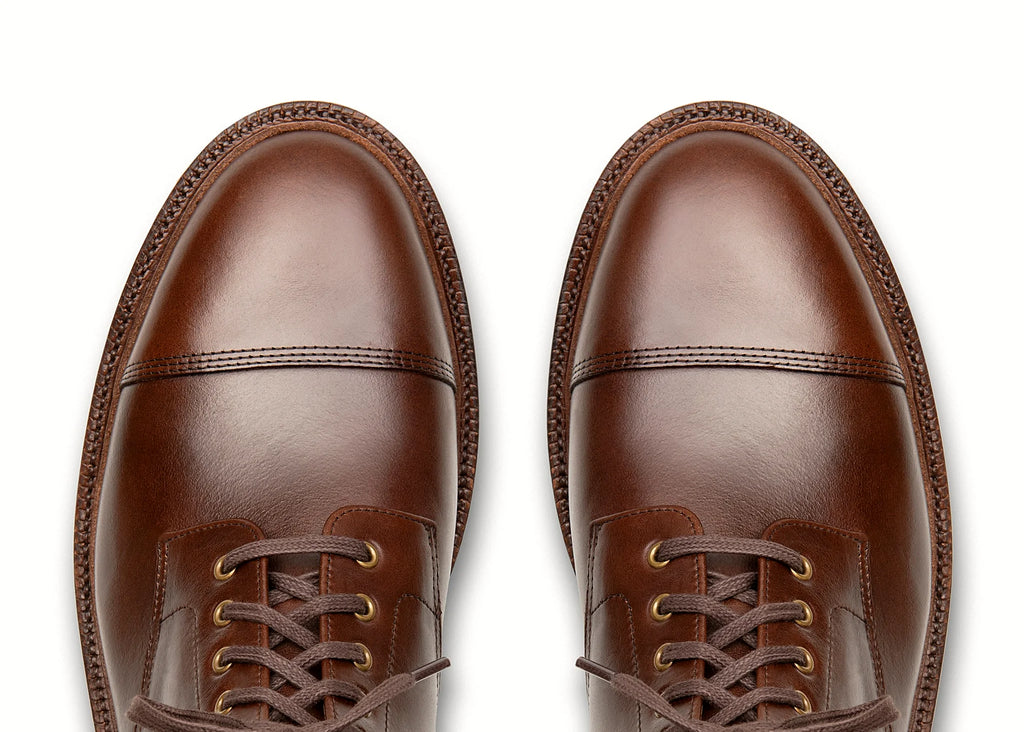 Crimson cap toe boot in Chromexcel, set on a micro stud rubber outsole