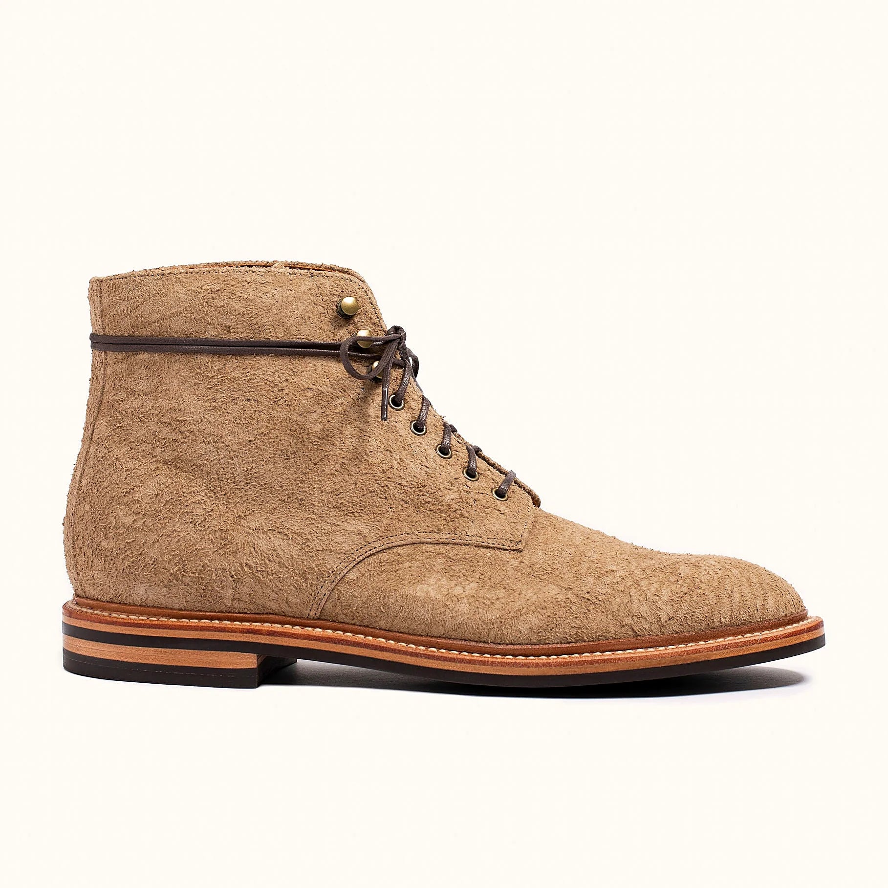 Milkshake rough suede boot on a micro stud rubber outsole, cork filler over a steel shank