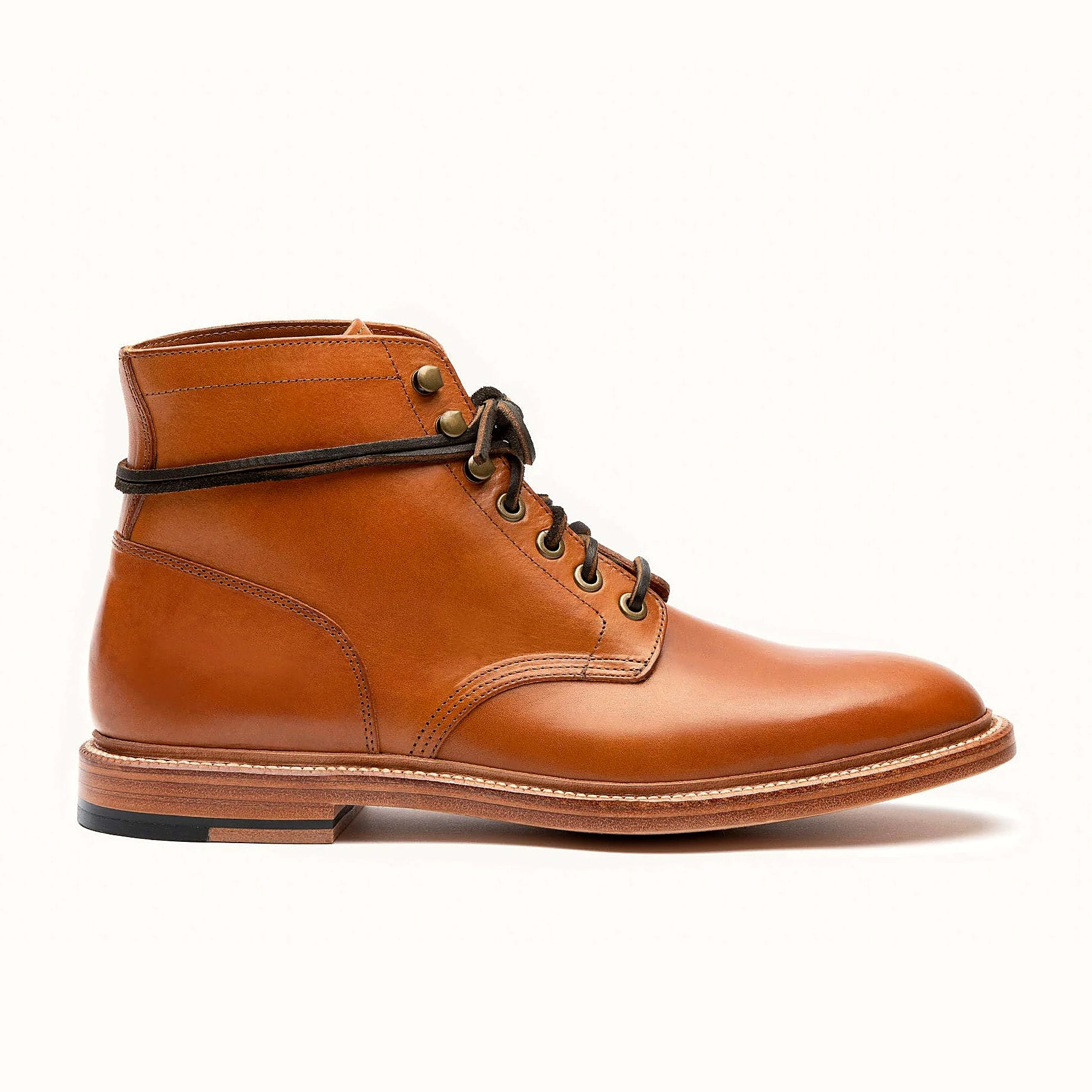 Goodyear welted plain toe boot in Saddle tan Minerva, full-grain leather heel counters
